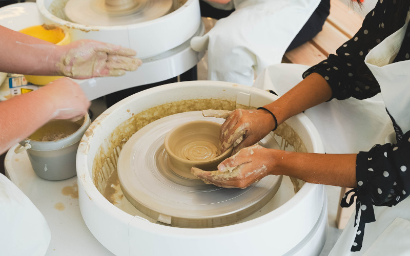 Freshly shaped clay bowl on a pottery wheel at Art Barn